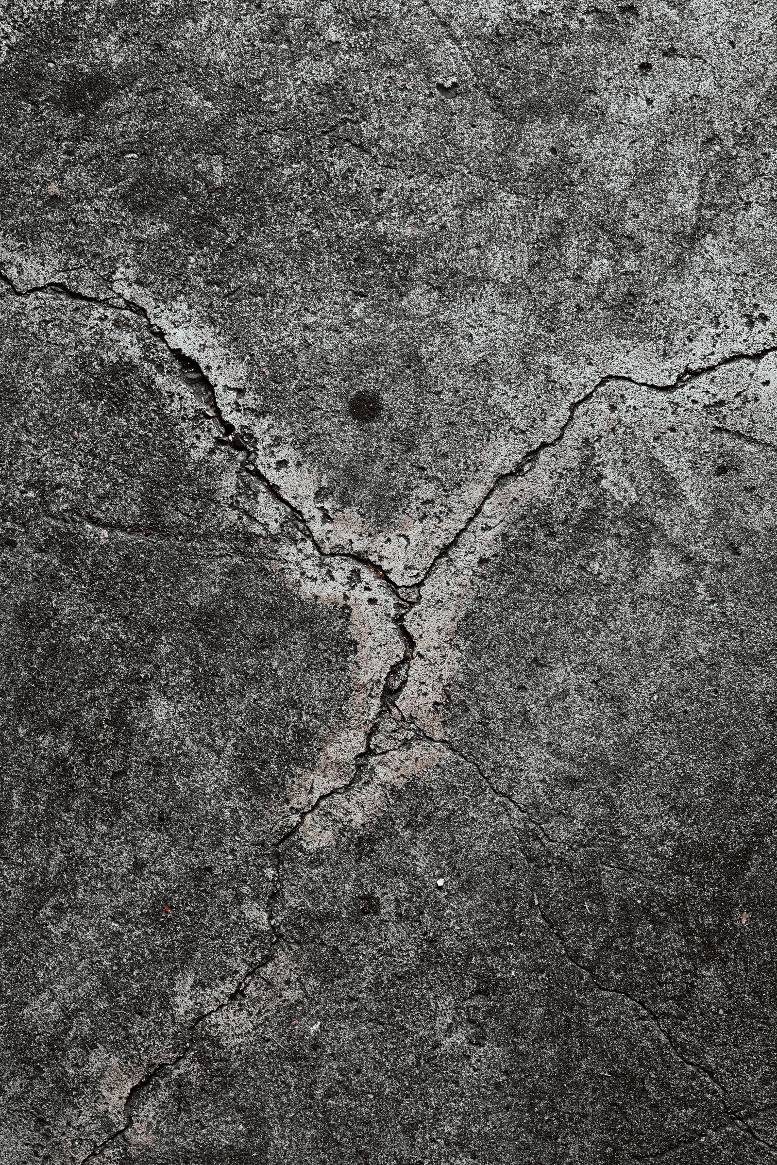 Close-up of a flaked epoxy garage floor coating showing the decorative flake locked under a clear polyaspartic top coat