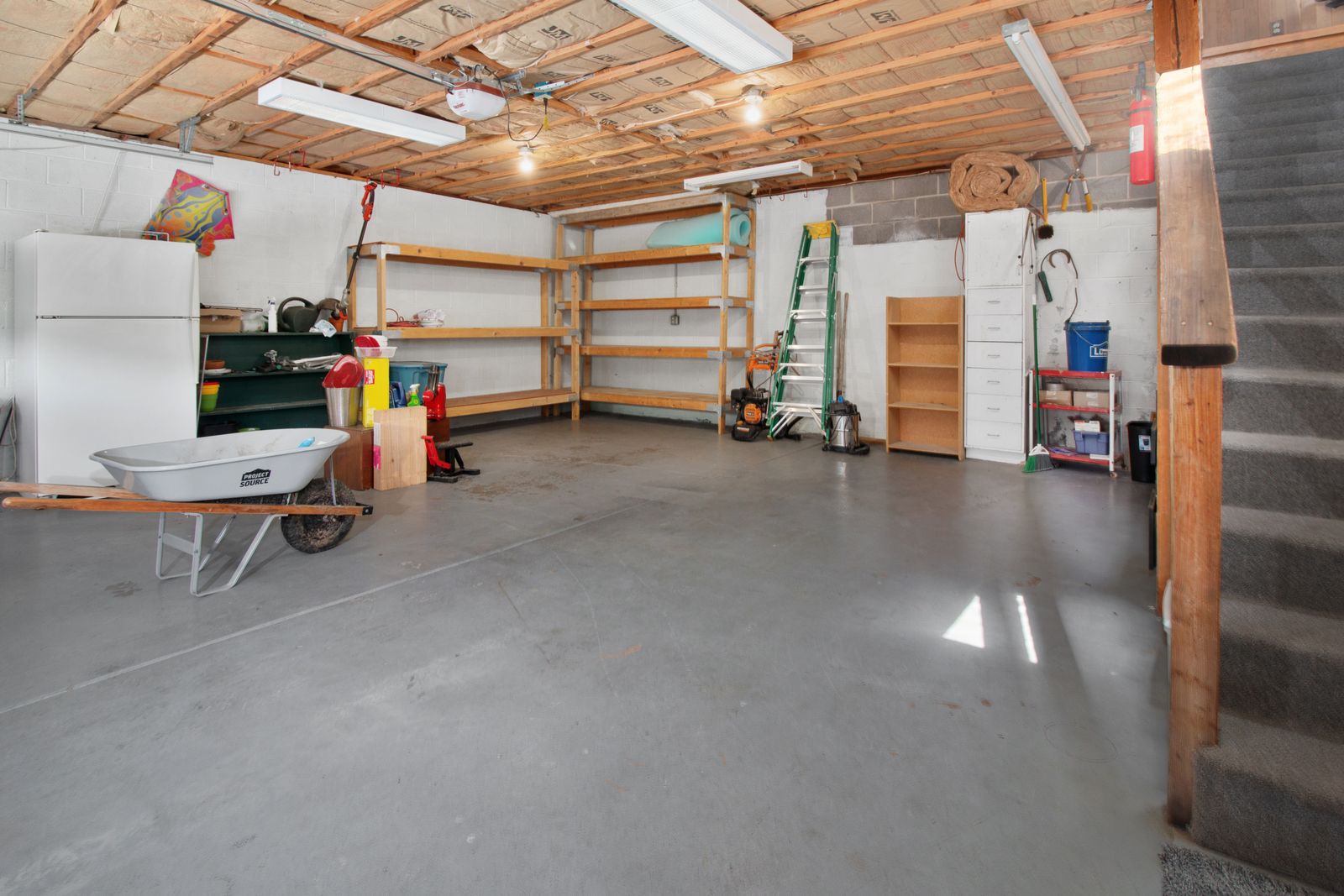 A finished garage built out with organized storage and cabinets